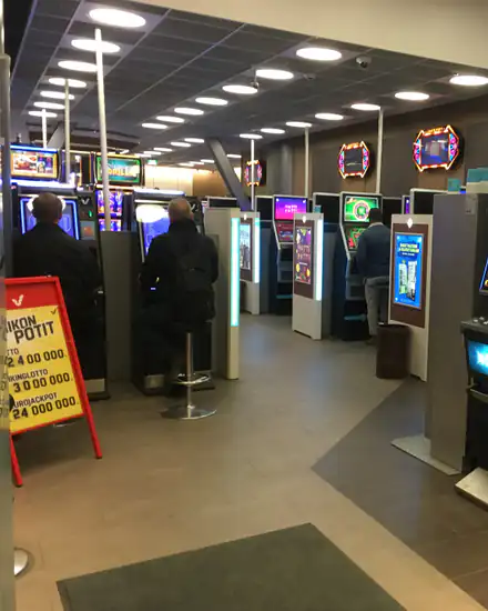 Players at rows of slot machines